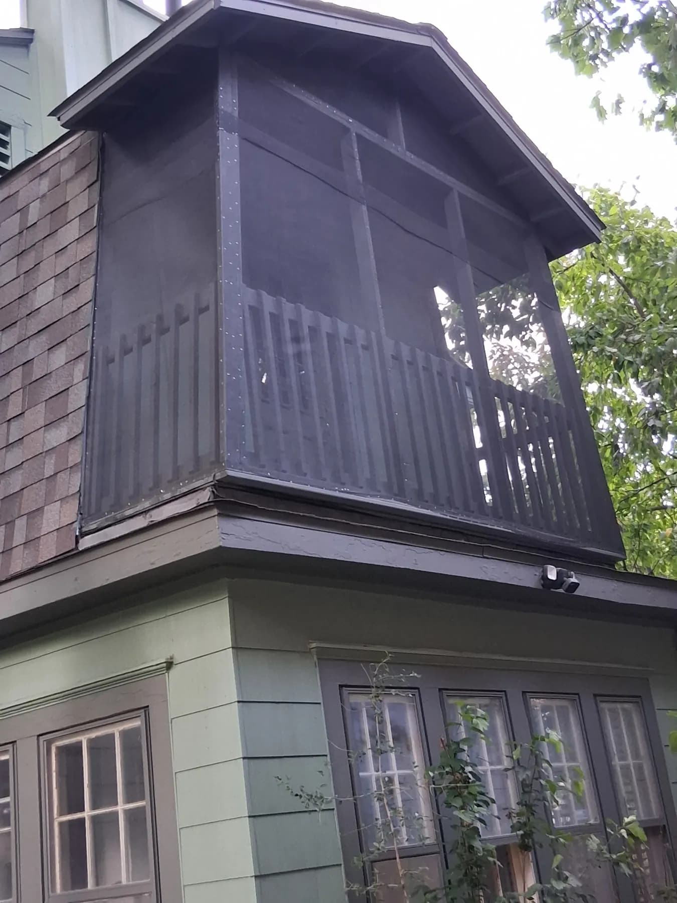 Upper-level deck enclosed with dark screening