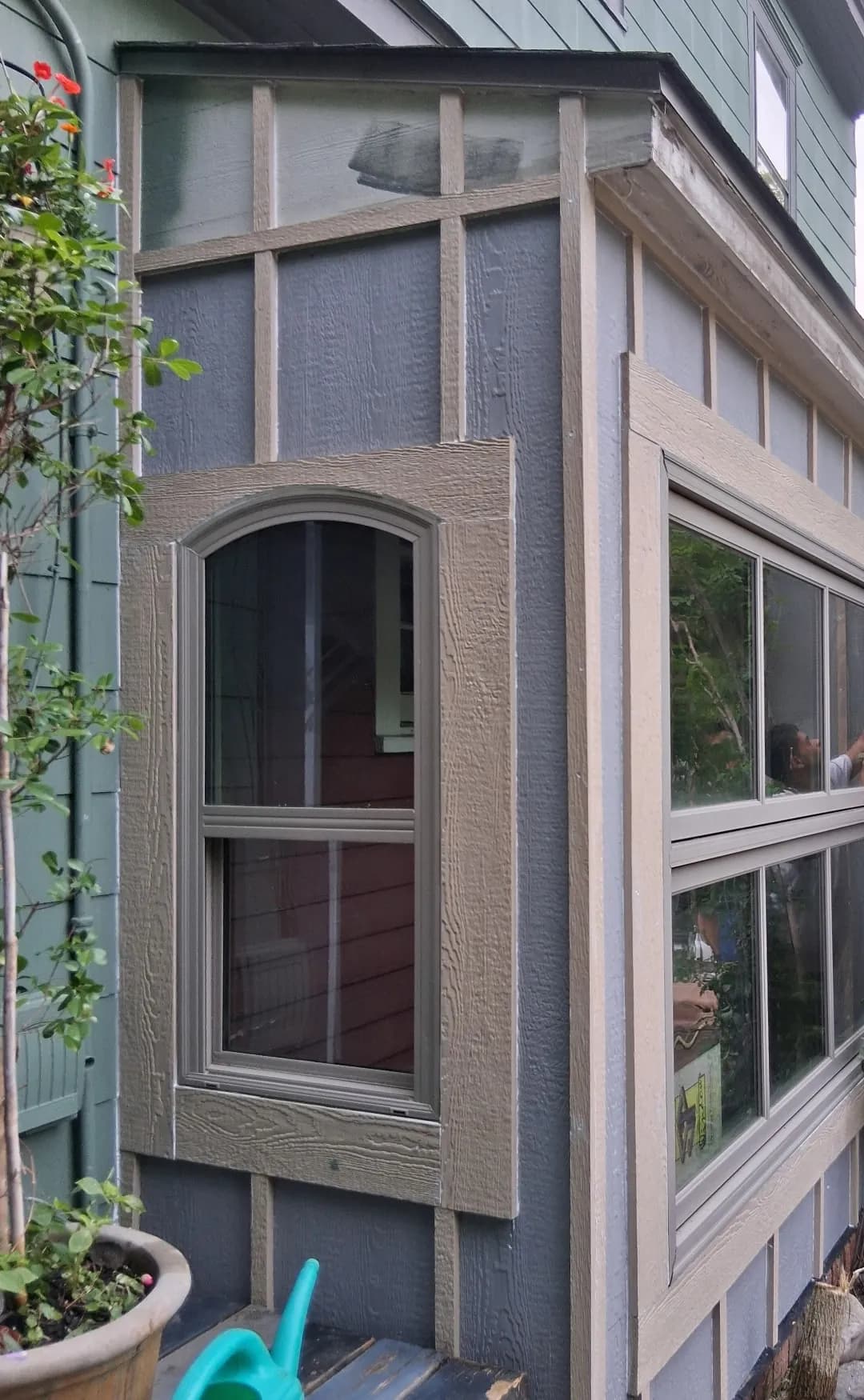 Exterior window enclosure with siding and trim work in progress